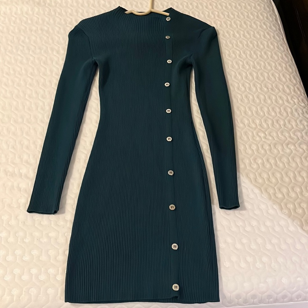 Pretty long-sleeved dress with buttons on the front